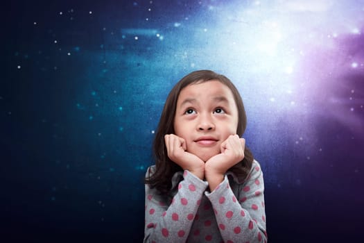 Cheerful asian kid thinking about something over futuristic background