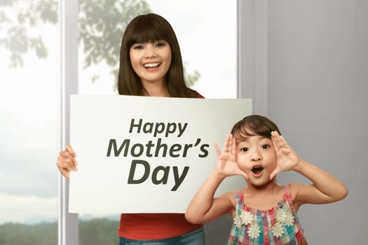 Young asian woman with her sister celebrate happy mother day at home