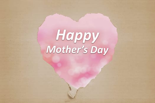 Happy Mothers Day message from ripped paper written over pink background