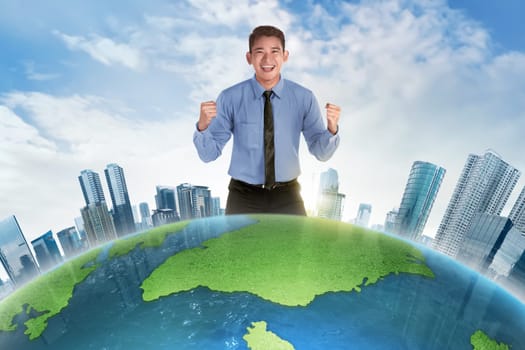 Happy asian businessman standing behind earth planet with modern building
