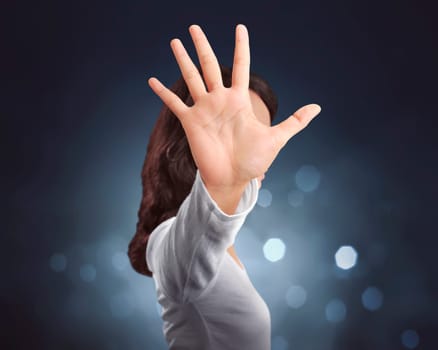 Young asian woman making stop sign with her hand over bright background
