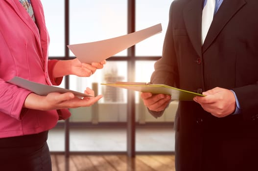 Business man and woman hand holding clipboard and paper over office background