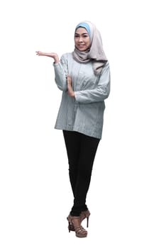 Young asian muslim woman with hijab showing copyspace area isolated over white background