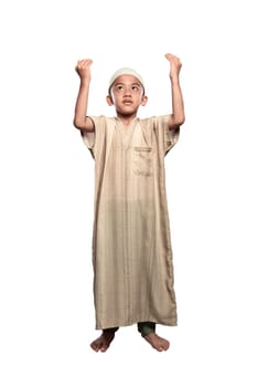 Portrait of asian muslim kid with cap praying isolated over white background