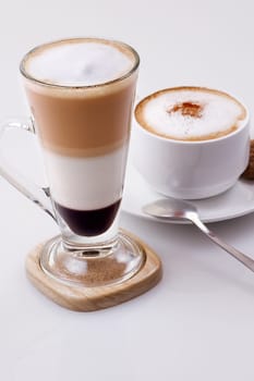 Ice coffee mocca and hot cappucino on white background