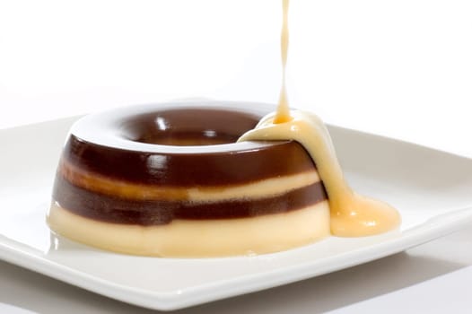 Pudding cover with cream on white background