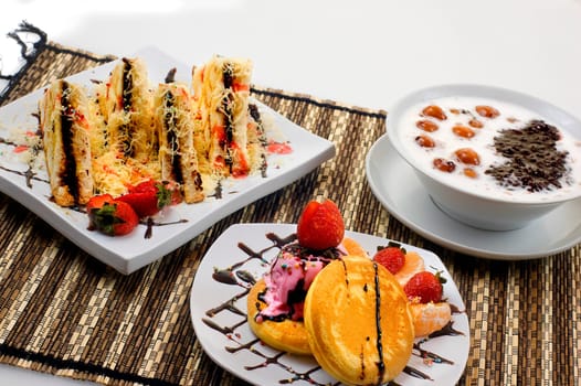 Bread toast with chocolate, candil, and pancake