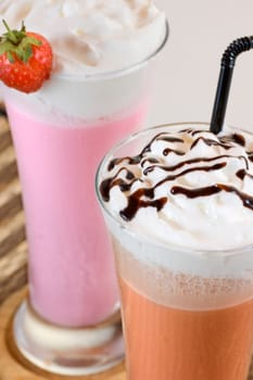 Two glass of strawbery and chocolate milk shake