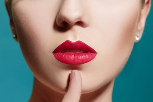The sensual portrait of beautiful woman model lady with fresh daily makeup with red lips and clean healthy skin face