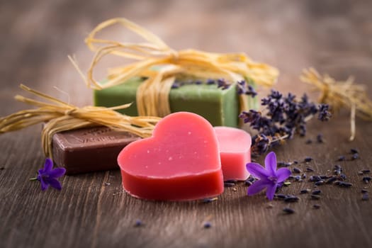 Handmade soap on wooden table with empty space