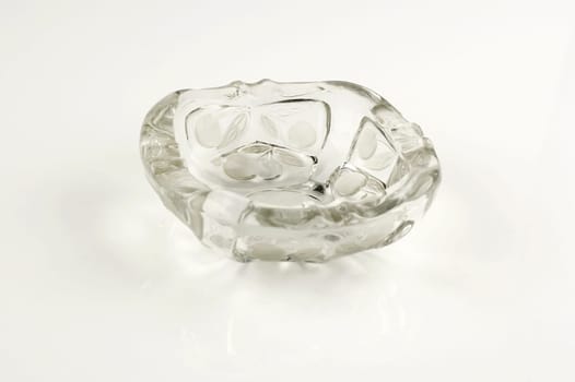 One glass ashtray isolated on white background