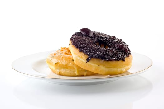 Two doughnut on plate on white background