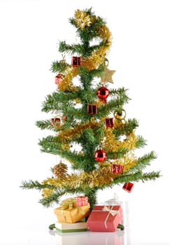 Decorated Fake christmas Tree full with ornament and gift over white background