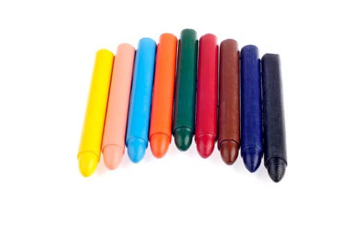 Colored wax crayons isolated on white background