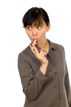 Young Beatiful Asian Woman eating cookie on white background