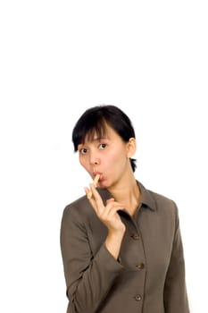 Young Beatiful Asian Woman eating cookie on white background