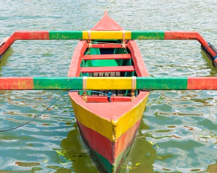Colourful traditional Balinese fishing boat on the water