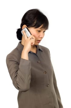Pretty Asian Woman, hear a bad news on her cellphone