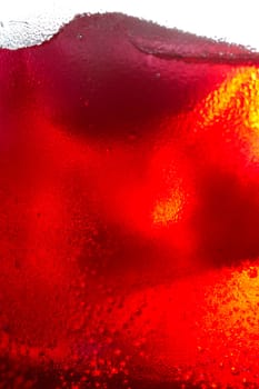 Red Soda Drinks with ice cube in the glass