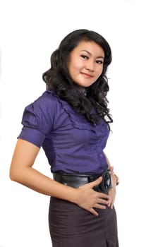 Asian model wearing blue shirt posing at white background. She looks pretty and fresh