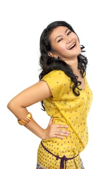 Asian Model Posing at white background. She looks pretty and fresh. Wearing yellow shirt