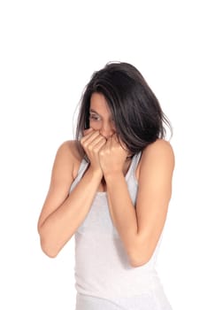 A young frightened woman holding her hands over her mouth, standing.closeup isolated for white background..