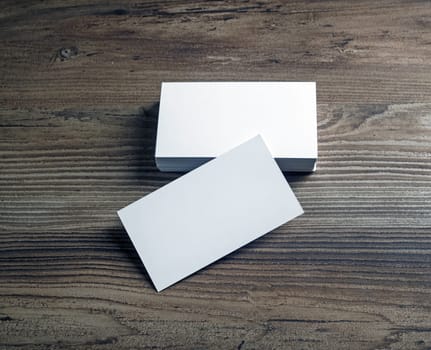 Blank bussiness cards on wood background. Mockup for ID. Template for promotion of corporate identity.