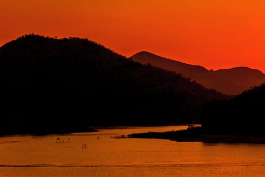 Sunset at lake, Kaengkrachan National Park Thailand,Sunset over lake with the beautiful cloud