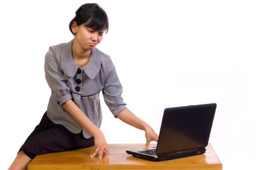 Beautiful asian business woman dizzy using laptop on white background