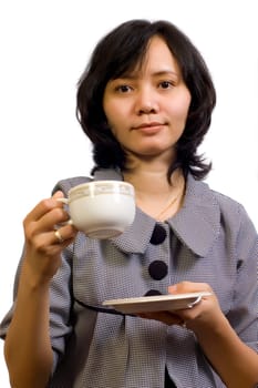 Beautiful Asian Business Woman drink a cup of coffee and sitting at the table