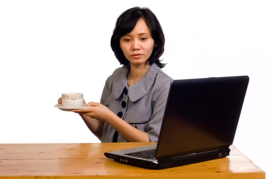 Beautiful Asian Business Woman drink a cup of coffee while working in white background