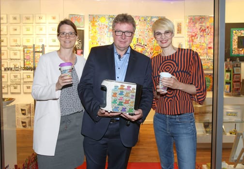Kristina Koelling,Bernd Feil ( Artist ) and Susann Atwell,. PopArt designs coffee traeume ! . Cafissimo Mini in design James Rizzi officially presented at Galerie Walentowski ,Europapassage Launch event JAMES RIZZI Cafissimo MINI - Limited Edition by Tchibo" in Hamburg."