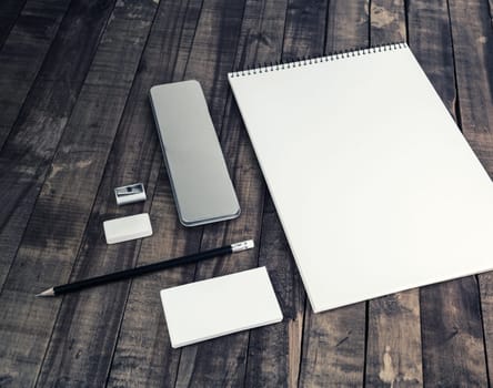 Blank stationery set on vintage wood background. Template with plenty of copy space for placing your design. Responsive design mock up.