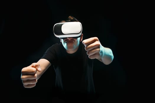 The man with glasses of virtual reality. Future technology concept. Black studio background