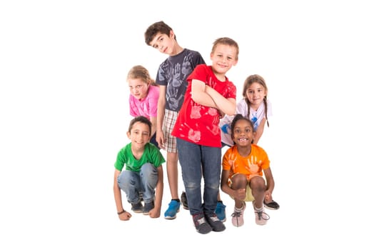 Group of children posing isolated in white