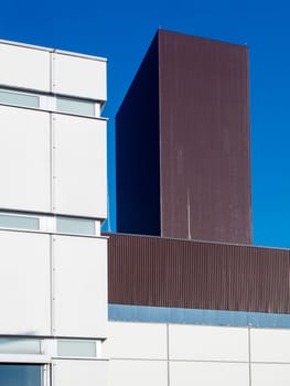 Power plant building. Industrial architecture in Berlin in front of a blue sky in Berlin.