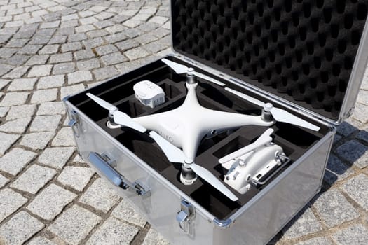 KAGAWA, JAPAN - JUNE 14, 2017: White drone Dji Phantom4 Pro stay in metal bag and ready to fly.
