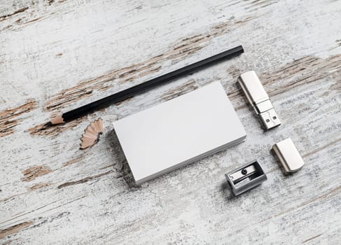 Template for ID. Responsive design mockup. Bank business cards, pencil, flash drive and sharpener on vintage wooden table background. Top view.