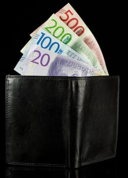 Wallet with Swedish Krona Currency on black background.