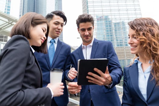 Group of buisness people working on tablet