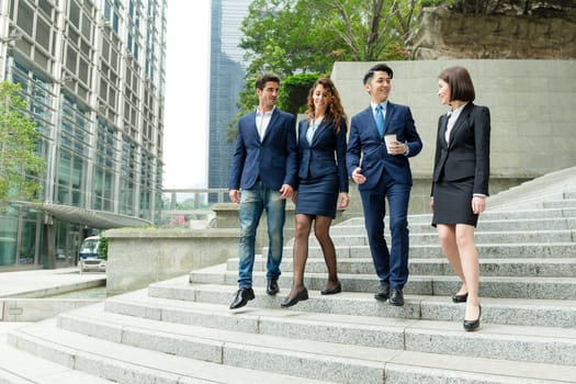 Business people walking together on street