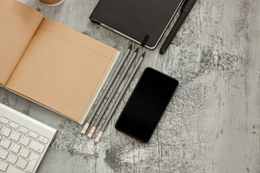 Office desk table with computer, supplies and mobile phone