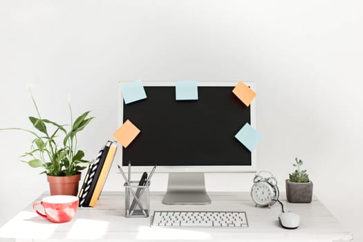 Stylish white workspace with computer on home or studio