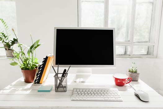 Stylish white workspace with computer at home or studio