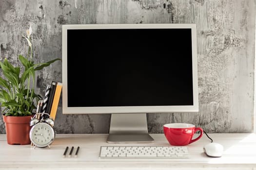 Stylish white workspace with computer at home or studio