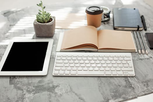Office desk table with computer, supplies and mobile phone