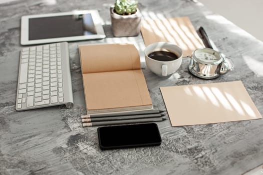 Office desk table with computer, supplies and mobile phone