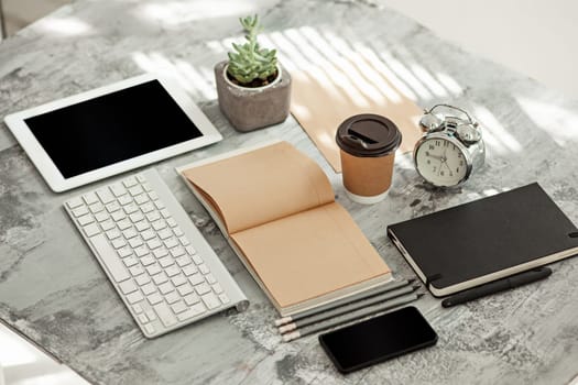 Office desk table with computer, supplies and mobile phone