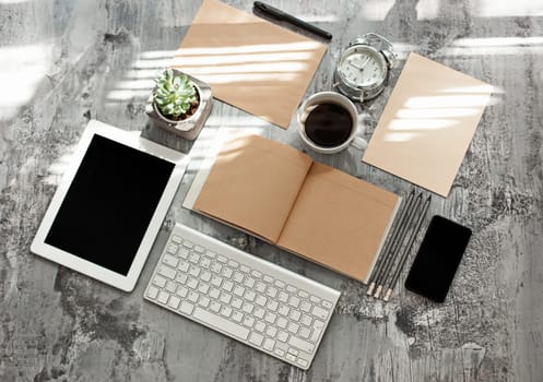 Office desk table with computer, supplies and mobile phone