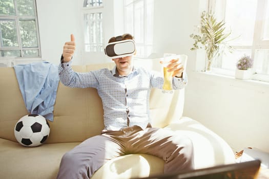 The man with glasses of virtual reality at home. Future technology concept.